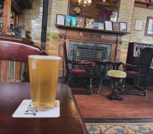 A half pint at the Marble Arch Inn, with the gently-sloping floor clearly on display