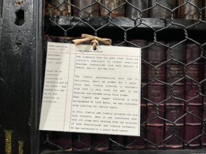 Inside Chetham's Library: information card about a previous Librarian removed for theft