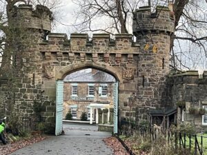 The Glynne Arms, framed by a gate