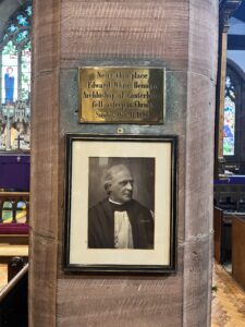 Inside St Deiniol's: picture and plaque to EW Benson